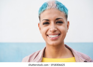 Portrait Of Hispanic Gay Woman Looking At Camera - Focus On Face