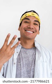 Portrait Of Hispanic Man Wearing Yellow Bandana