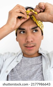 Portrait Of Hispanic Man Wearing Yellow Bandana