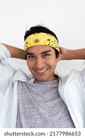 Portrait Of Hispanic Man Wearing Yellow Bandana