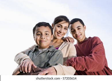 Portrait Of Hispanic Mother And 10 Year Old Son Outdoors