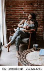 Portrait Of Hispanic Mother And Daughter Having Fun At Home In Mexico Latin America