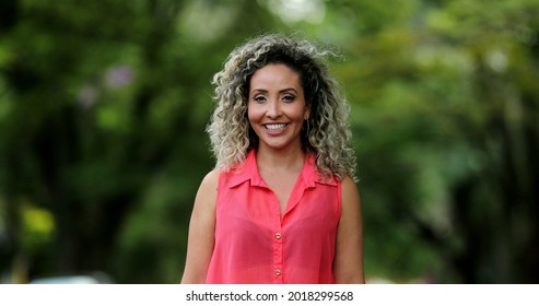 Portrait Hispanic Woman Smiling Outside At Park, Casual Real People