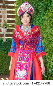 portrait of Hmong young woman in tradition Hmong costume for young girl; Asian ethnic tribal people in traditional colorful clothing culture of Hmong or Miao people in east Asia and southeast Asia