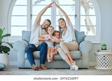 Portrait, home and happy family with roof hands on sofa for support, security and safety, trust or house insurance. Property, protection or kids with heart emoji for parents, investment and comfort - Powered by Shutterstock