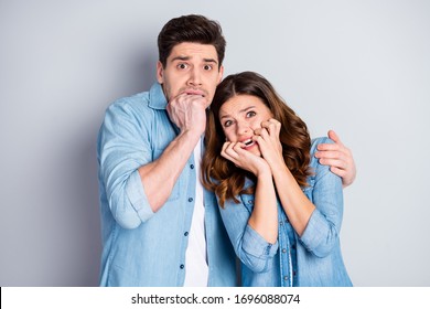 Portrait Of Horrified Anxious Couple Watch Thriller Series Instead Romantic Movie Feel Fear Bite Fingers Wear Casual Denim Fashion Jeans Shirt Isolated Over Gray Color Background