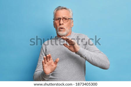 Similar – Image, Stock Photo Man covering himself with summer hat at countryside.