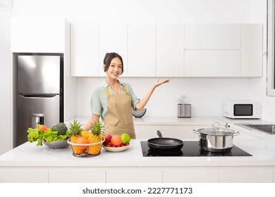 Portrait of a housewife in the kitchen at home - Powered by Shutterstock