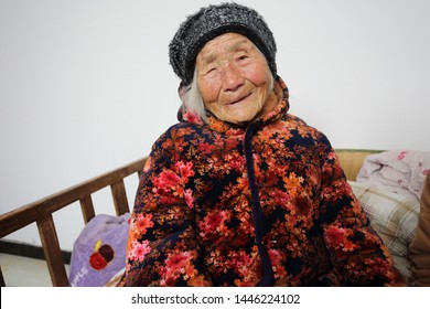 Portrait of a hundred years old woman, born in 1919, the last generation that bind the feet of woman