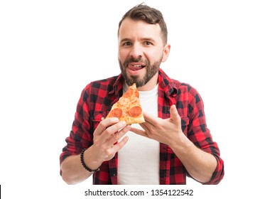 Portrait Of Hungry Man Licking Lips While Holding Tasty Pizza Slice