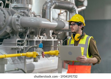 Portrait of HVAC engineer working in boiler room, Engineer working in gas boiler room for steam production of factory industrial manufactured, working in the boiler room, maintenance concept
