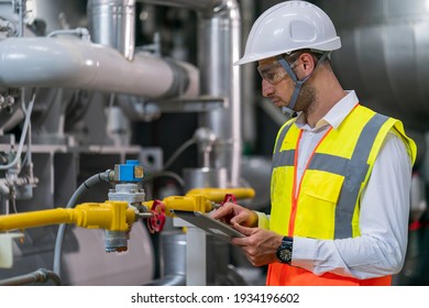 Portrait Of HVAC Engineer Working In Boiler Room, Engineer Working In Gas Boiler Room For Steam Production Of Factory Industrial Manufactured, Working In The Boiler Room, Maintenance Concept