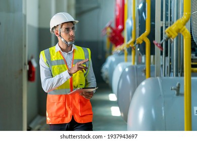 Portrait Of HVAC Engineer Working In Boiler Room, Engineer Working In Gas Boiler Room For Steam Production Of Factory Industrial Manufactured, Working In The Boiler Room, Maintenance Concept