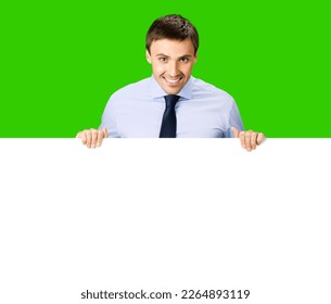 Portrait image of business man professional bank manager in confident cloth. Businessman stand behind hang over empty white banner signboard with copy space. Isolate green chroma key background - Shutterstock ID 2264893119