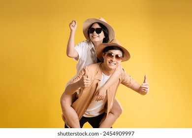 Portrait image of couple posing on yellow background, summer, travel - Powered by Shutterstock