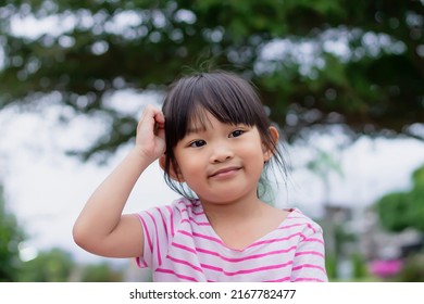 Portrait Image Of Happy Asian Child Girl. She Smiling And Thinking Of Something. 4-5 Years Old Childhood And Preschoolers.