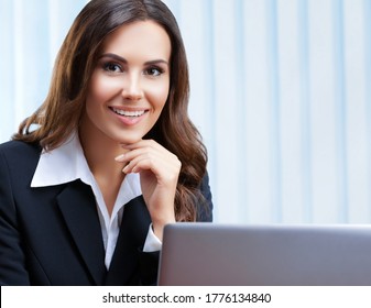 Portrait Image Of Happy Smiling Beautiful Businesswoman In Confident Style Suit Using Laptop Computer At Office. Success In Business, Job And Education Concept. Zoom Video Conference Meeting Or Skype.