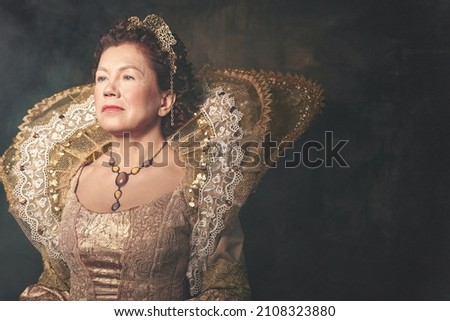 Portrait of the image of Queen Elizabeth I of the 16th century. Historical reconstruction. The image of the queen in smoke on a gray background. High quality photo