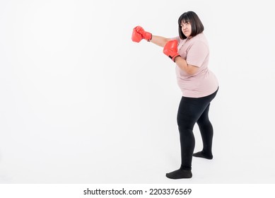 Portrait Images Of Asian Fat Woman Wearing Red Boxing Gloves On White Background, Concept To Fat Woman Fighting Healthy Weight Loss.