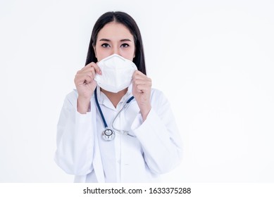 Portrait Images Of Asian Woman Doctor Holding A Mask With White Background, Concept To Health Care And Primary Disease Prevention, Such As PM 2.5 And Coronavirus