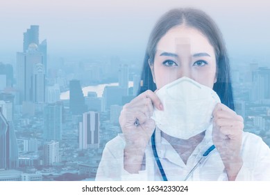 Portrait Images Of Asian Woman Doctor Holding A Mask With White Background, Concept To Health Care And Primary Disease Prevention, Such As PM 2.5 And Coronavirus