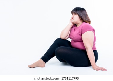 Portrait images of Fat woman sitting and she is sad Because of her fatness, On white background, to fat woman and health care concept.