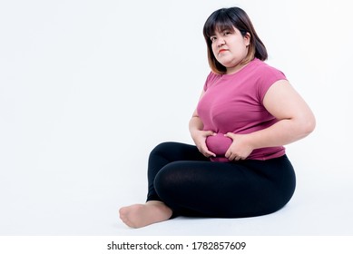 Portrait images of Fat woman sitting and using her hands to grasp the belly fat Which has its own size, On white background, to fat woman and health care concept. - Shutterstock ID 1782857609