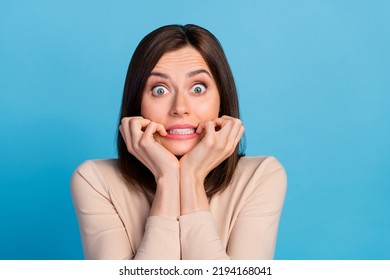 Portrait Of Impressed Scared Lady Teeth Biting Finger Nail Staring Isolated On Blue Color Background