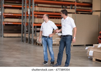 Portrait of independent designers in their furniture manufacturing workshop, looking relaxed and confident - Powered by Shutterstock