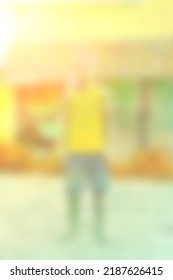 Portrait Of An Indian Or Asian Young Farmer. Blurred Or Defocused Abstract Image. Copy Space.