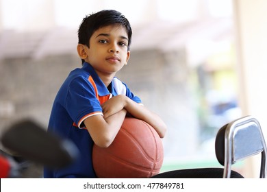 Portrait Of Indian Boy With Basketball