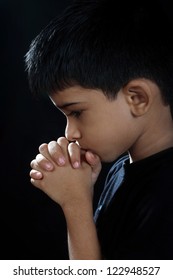 Portrait Of Indian Boy Praying