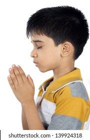 Portrait Of Indian Boy Praying