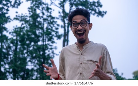 Portrait Of An Indian Boy Surprised And Wow Facial Expression | Close Up Of A Too Much Excited Asian Teen Boy At Outdoor | Happy And Cheerful