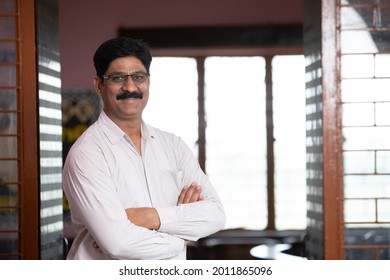 Portrait Of Indian Male Teacher Outside Of Library