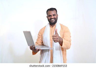 Portrait Of An Indian Man Holding Laptop