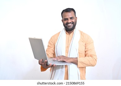 Portrait Of An Indian Man Holding Laptop