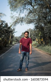 Portrait Of Indian Men  In A Red T Shirt Standing On Road