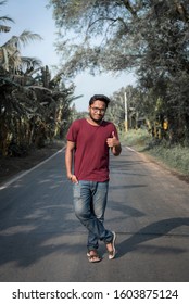 Portrait Of Indian Men  In A Red T Shirt Standing On Road