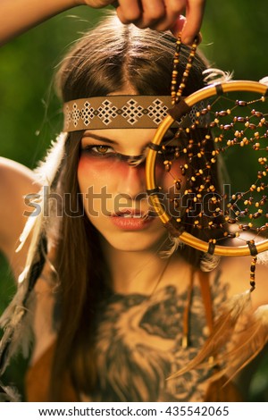 portrait of indian native american woman holding Dreamcatcher. pocahontas.  American Indian 