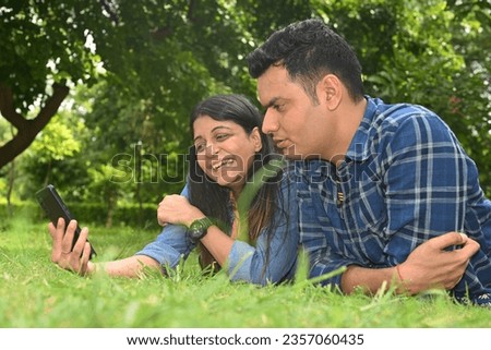 Similar – Man holding hot dog in barbecue with friends