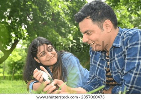 Similar – Man holding hot dog in barbecue with friends