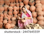 Portrait of an Indian people painting mud pot in village