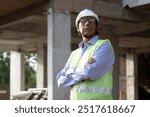 Portrait of Indian senior civil engineer man standing and crossed arm with wearing white hardhat behind at construction site factory produce precast concrete. Engineer builder at construction site. 