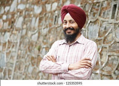 Portrait Of Indian Sikh Man In Turban With Bushy Beard