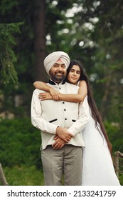 Portrait of Indian sikh man in turban with daughter