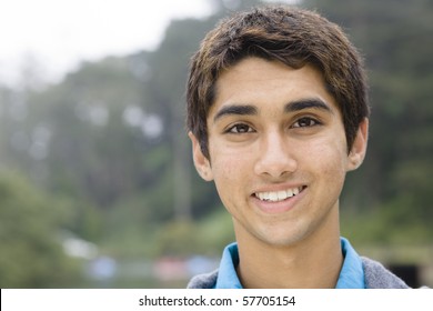 Portrait Of An Indian Teen Boy Smiling Directly To The Camera