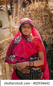 Portrait of an Indian villager woman in red saari (traditional dress) 2 may 2012, Lalitpur, India.