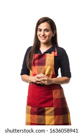 Portrait Of Indian Woman Chef Or Cook In Apron, Presenting, Pointing, With Ok Sign, Thumbs Up Or Hands Folded. Standing Isolated Over White Background