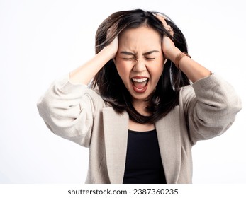 A portrait of an Indonesian Asian woman wearing a cream-colored blazer, feeling emotional, having a headache, and holding her head. Isolated against a white background.